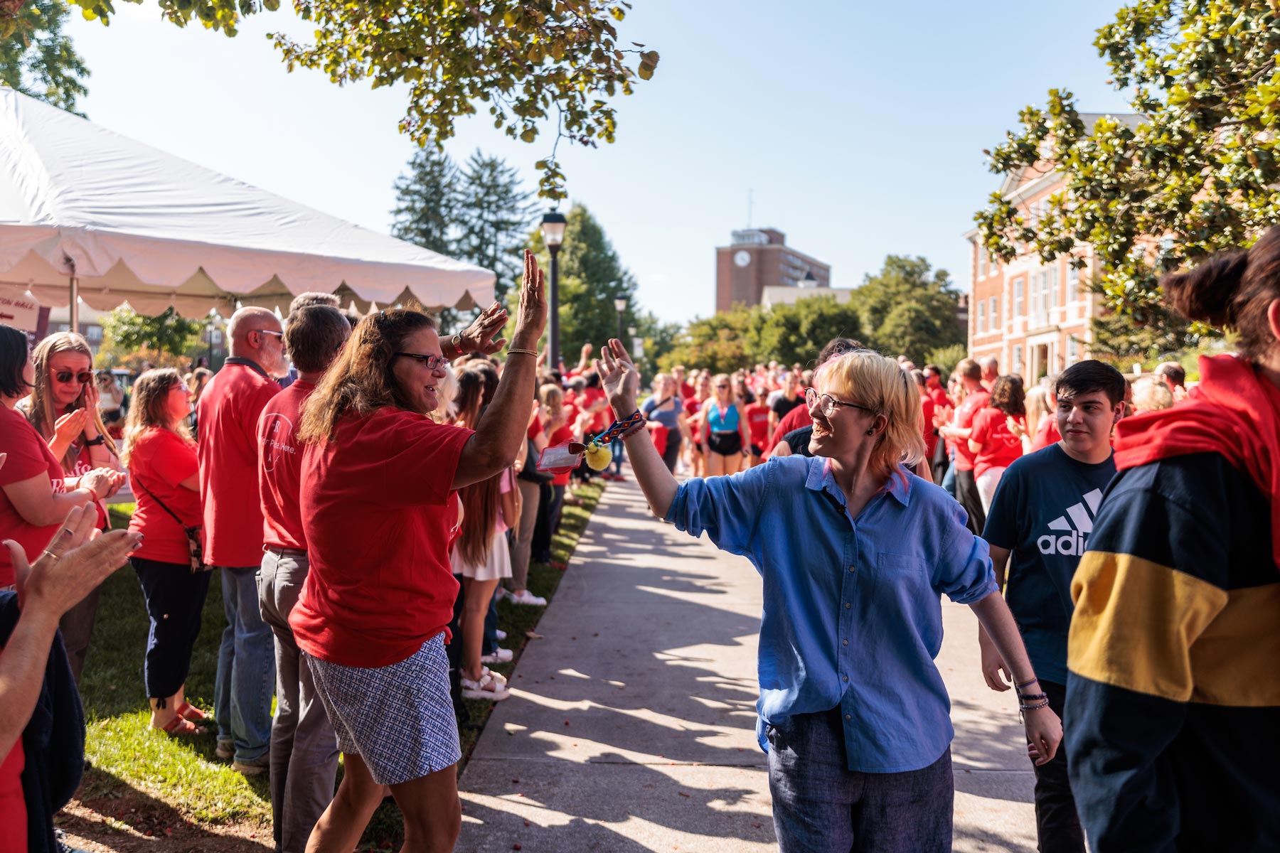 students getting high fives from faculty during student convocation