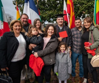 student with family on commencement day