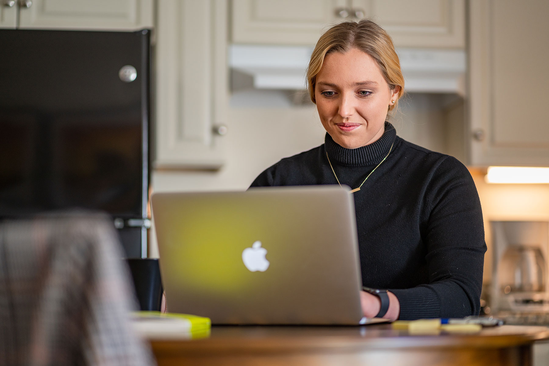 female student working online at home