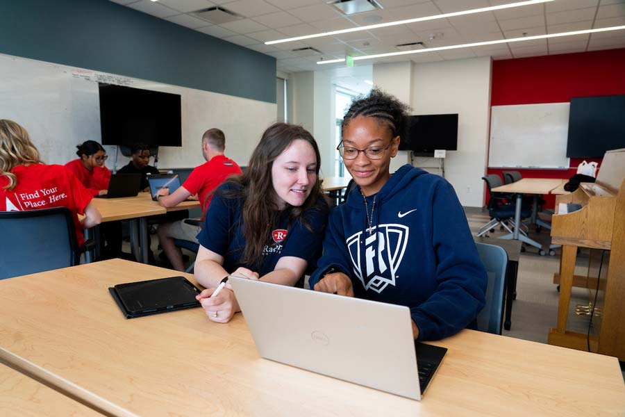 students together at a computer