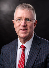 Headshot of Adam Joyce
