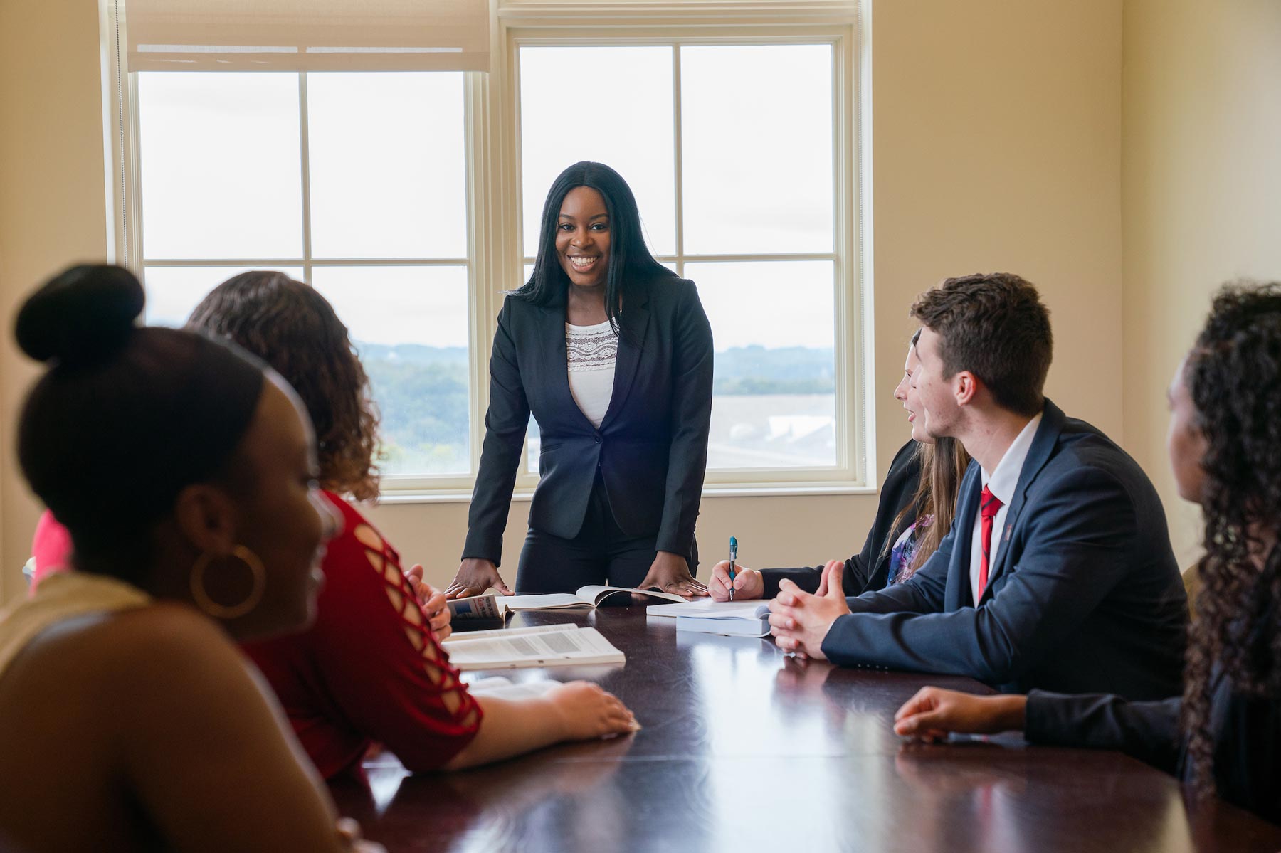 students in a professonal setting boardroom