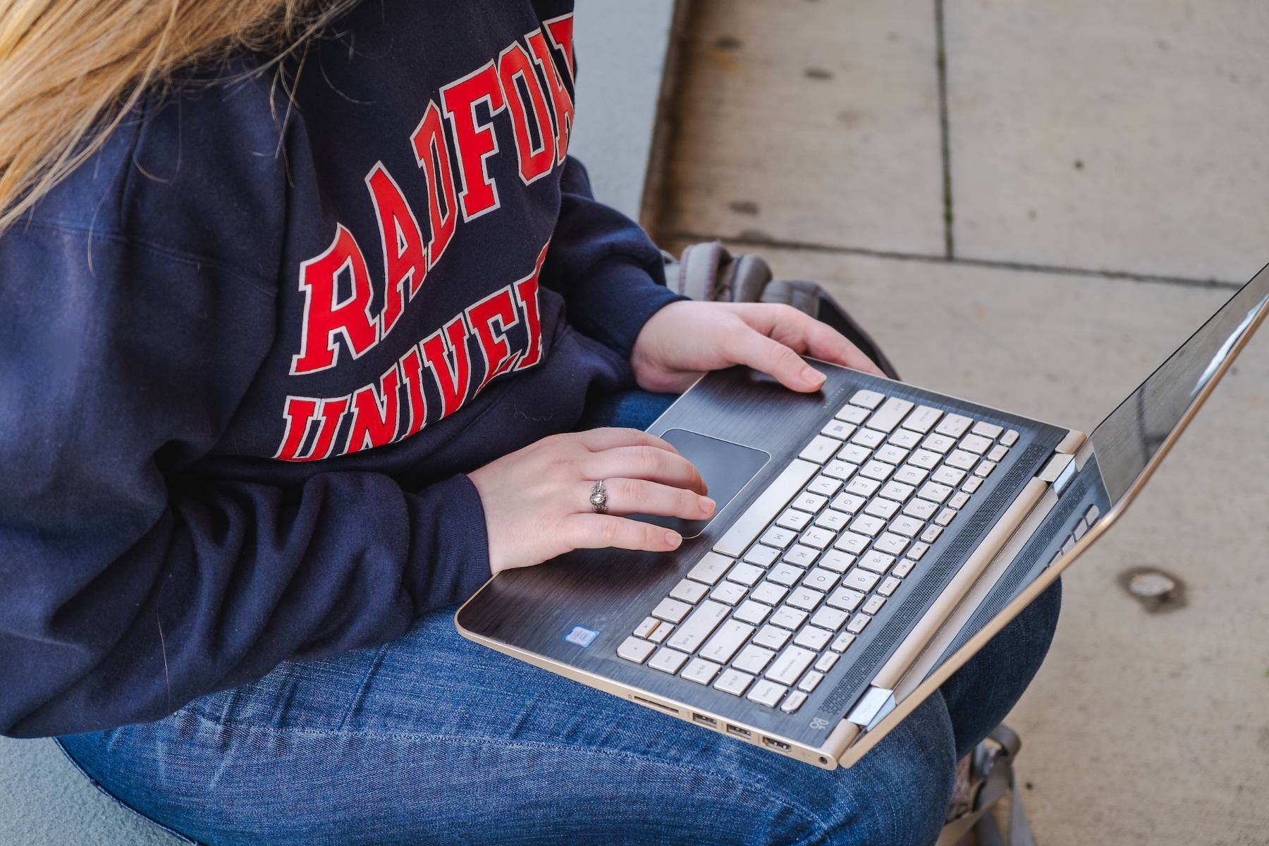 woman sitting in front of an open laptop