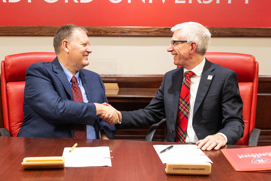 SWCC President Tommy Wright and Radford University President Bret Danilowicz shake hands