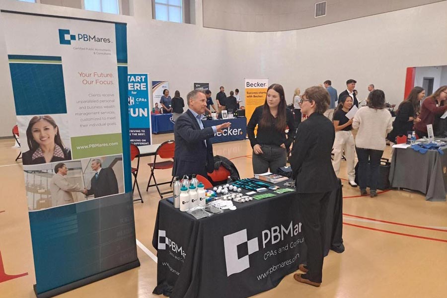 Participants at a Radford University job fair engage in discussion.