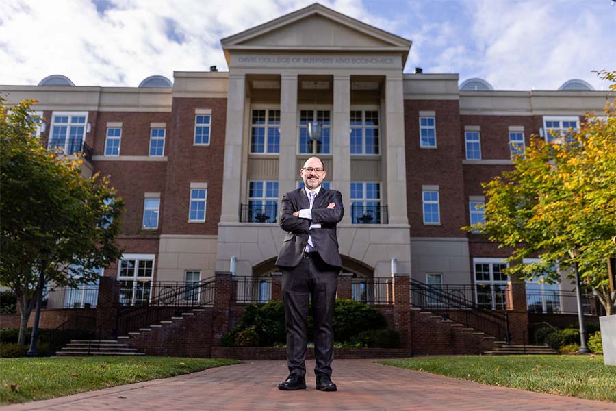 A professor stands outside Radford University