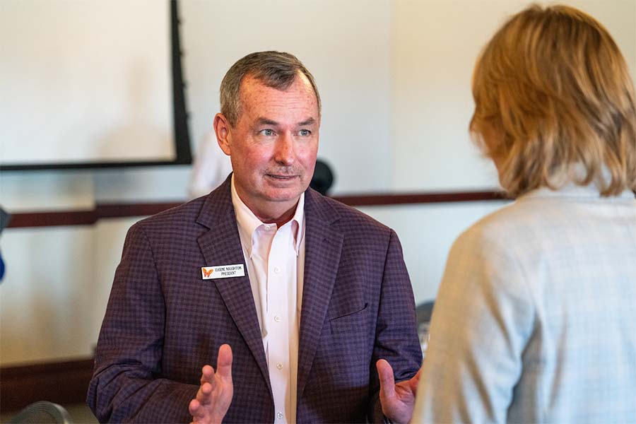 Dollywood President Eugene Naughton speaks with a student