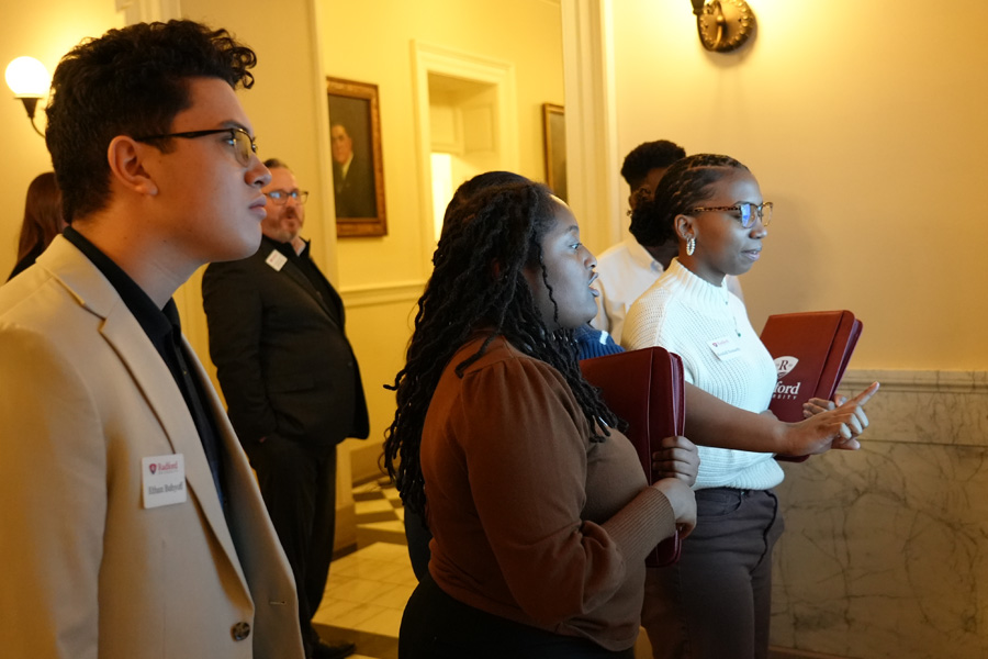 Ethan Buhyoff (left) and Jada Freeman (center) view exhibits in the Virginia Capitol during a tour on January 29