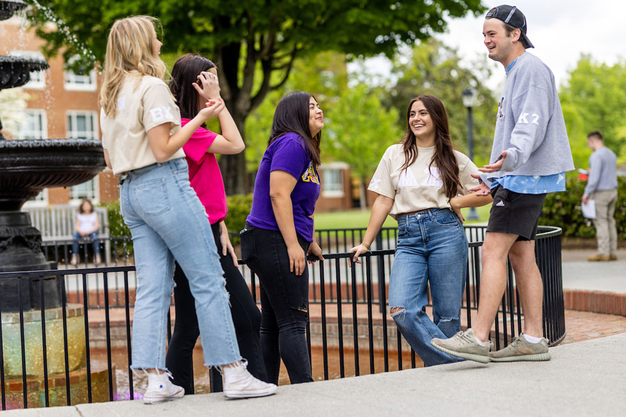 Students talking by the Fountain on campus