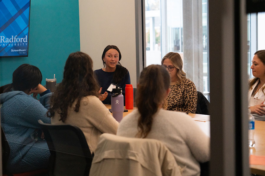 Students chat during the IPE event
