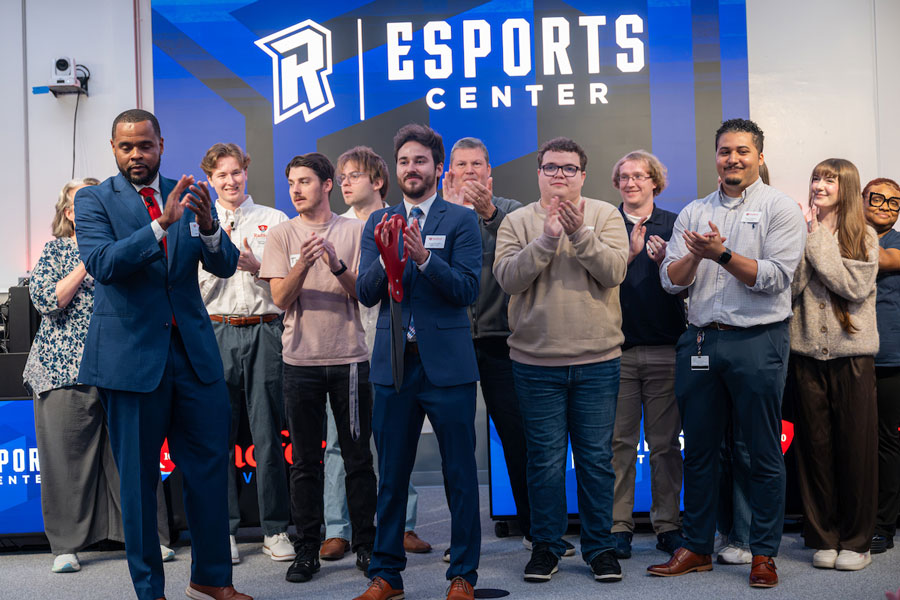 Staff and students gather at a ribbon cutting for Radford's expanded Esports Center