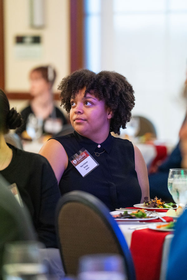student at etiquette dinner