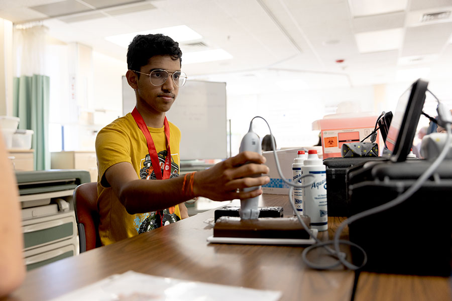 A Governor’s School student works with an ultrasound machine with the Radford physician assistant program.
