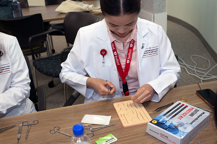 A Governor’s School student practices suturing at the Virginia Tech Carilion School of Medicine.