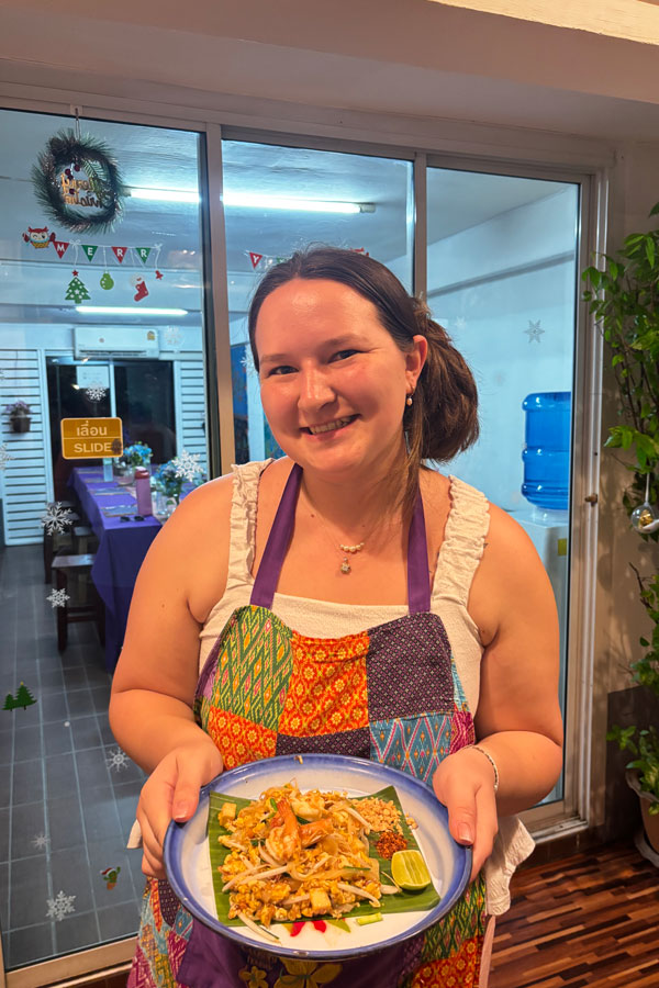 Student holding food in Thailand
