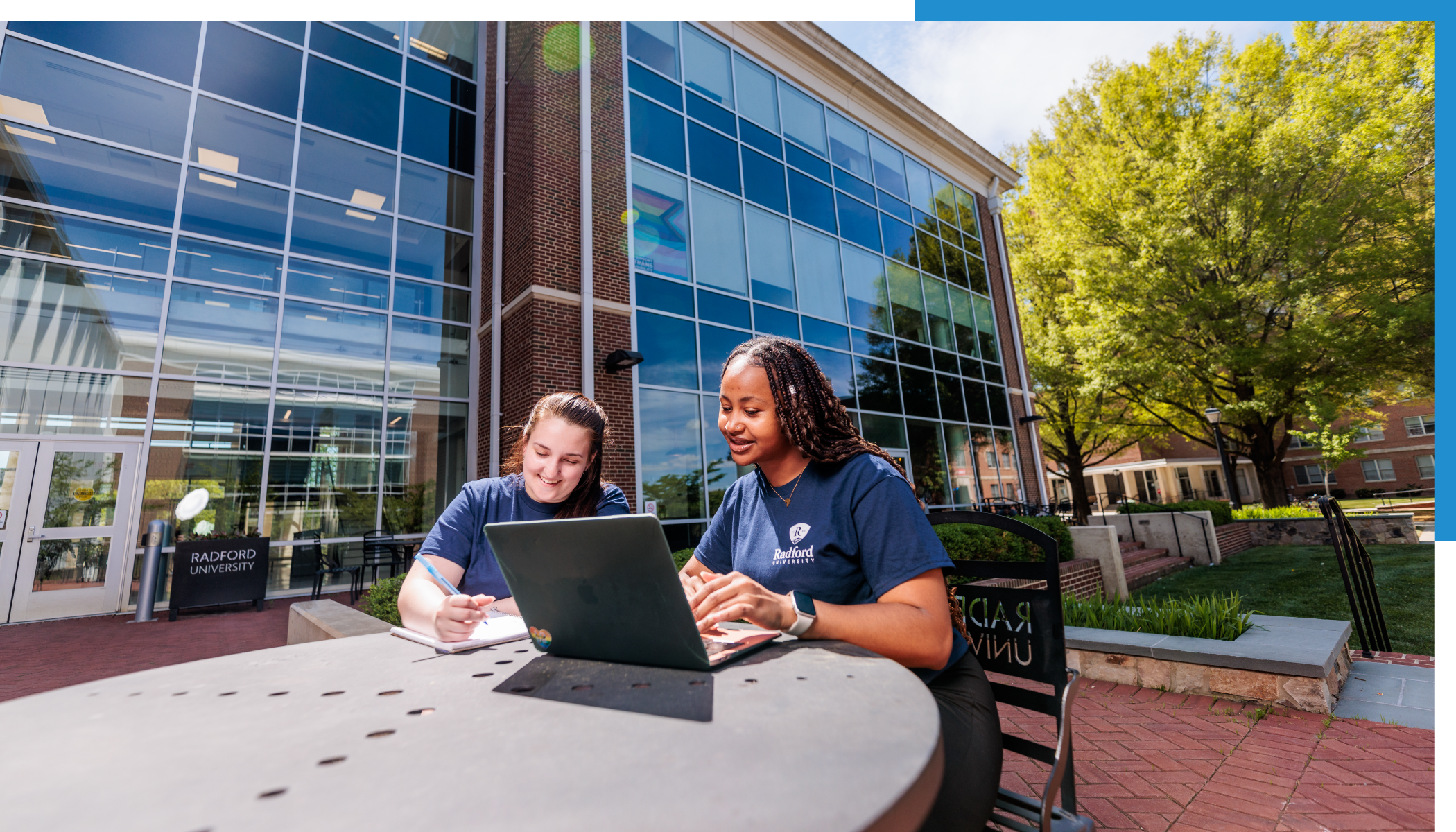 students looking at a laptop