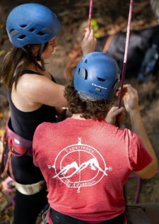 Students setting up for outdoor rock climbing