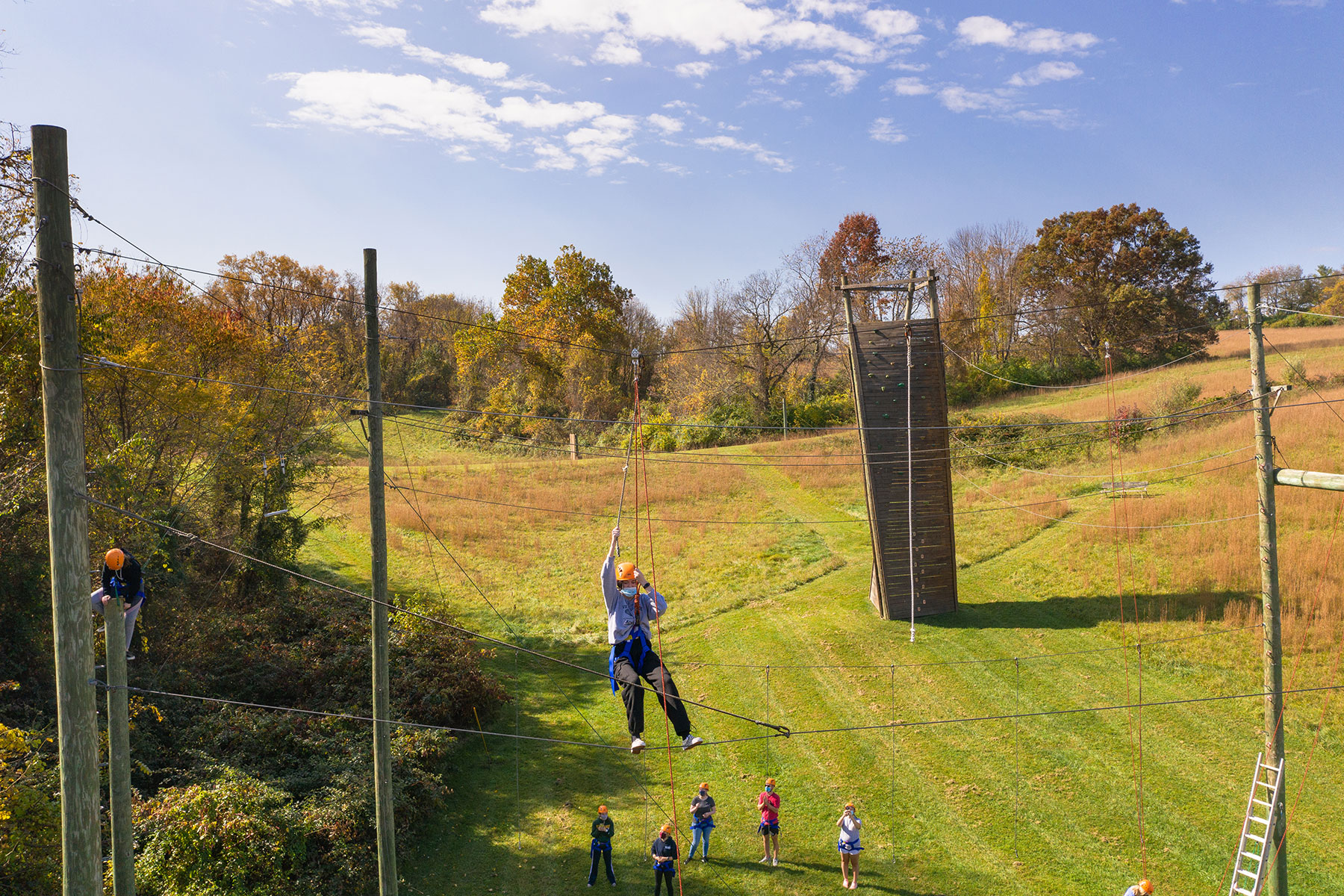 Students participating in an outdoor obstacle course.