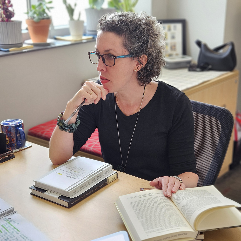 Carlee Bradbury at her desk decorative
