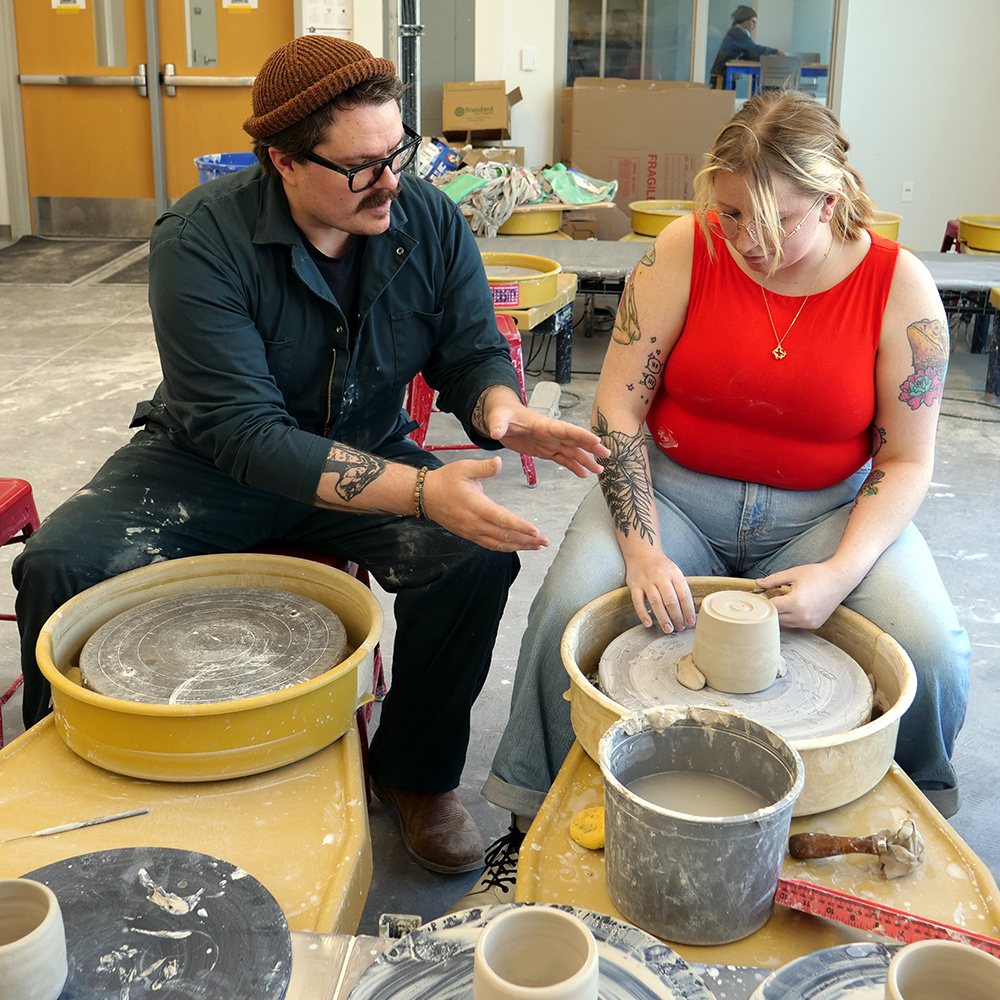 Will Sawyer with student at the potting wheel