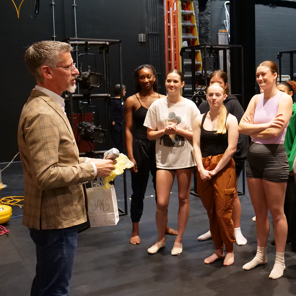 James Robey talking with dance students.