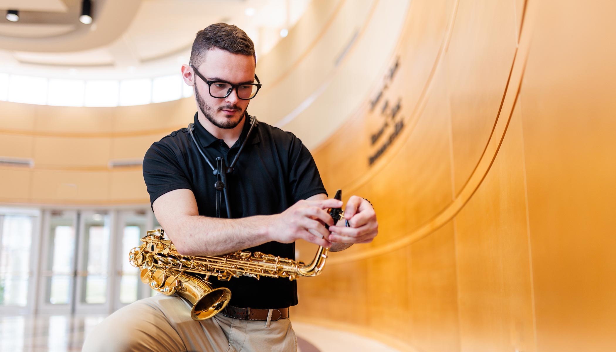 music student with saxophone