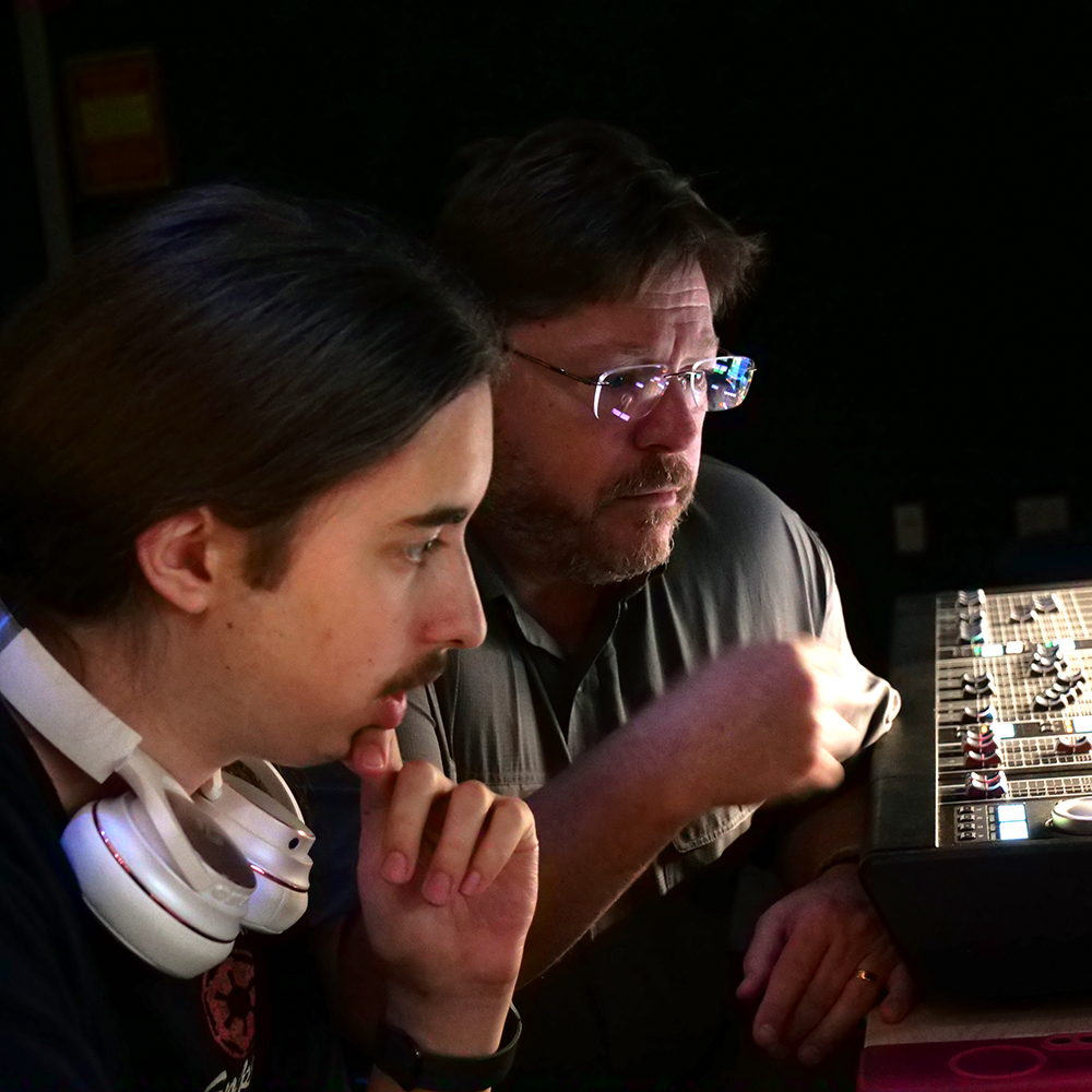David Wheeler with a student working on a computer